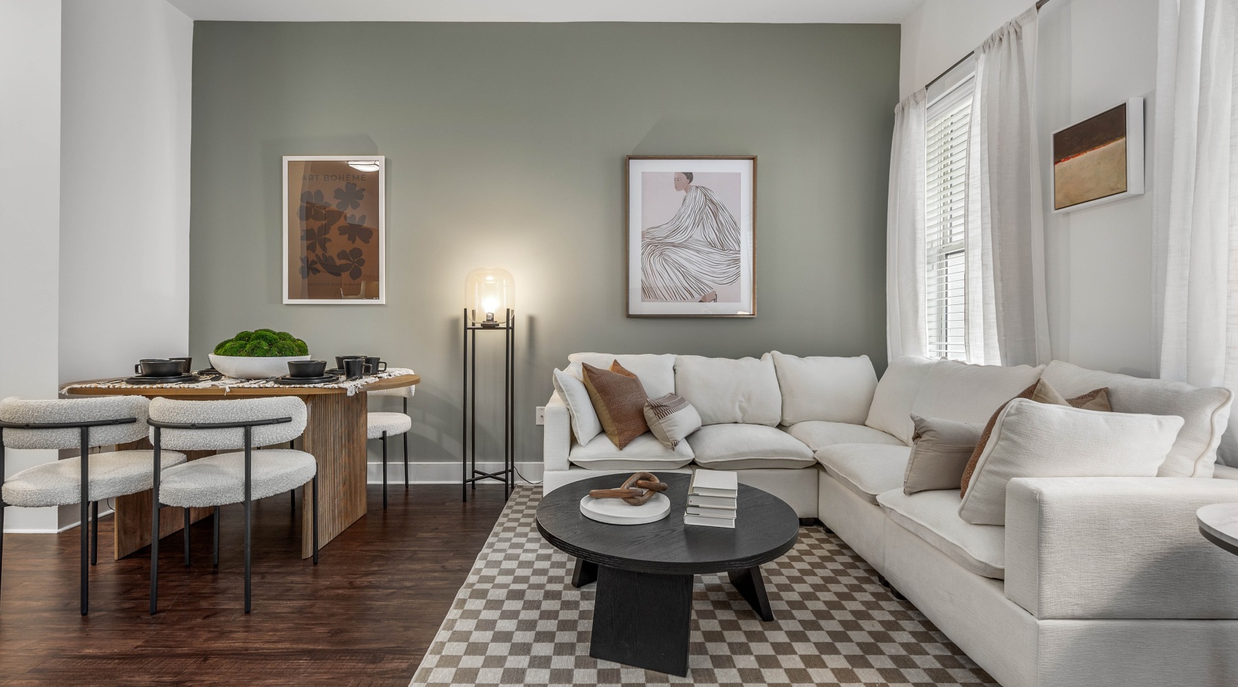Spacious floor plans Living room with couch, coffee table, and dining table