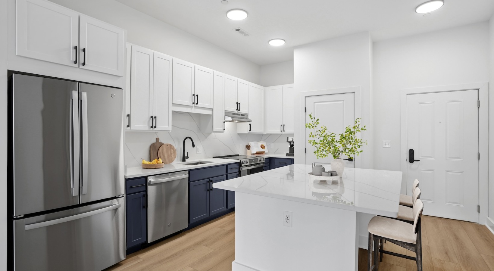 a kitchen with white cabinets