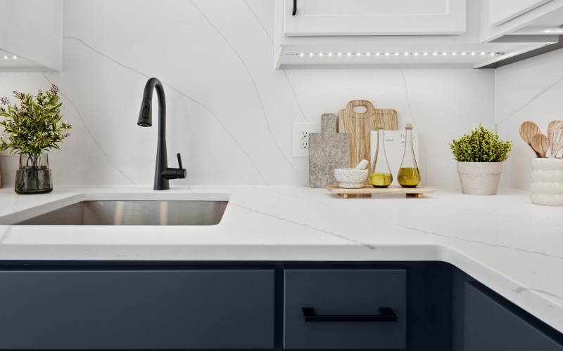 View of white quartz countertops in a renovated apartment 