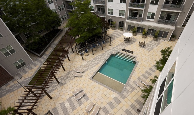 Resort-style swimming pool with lounge seating