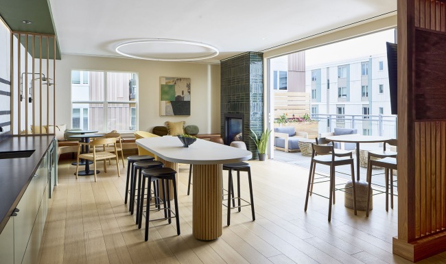 A sky lounge with seating fireplace and exterior roof deck 