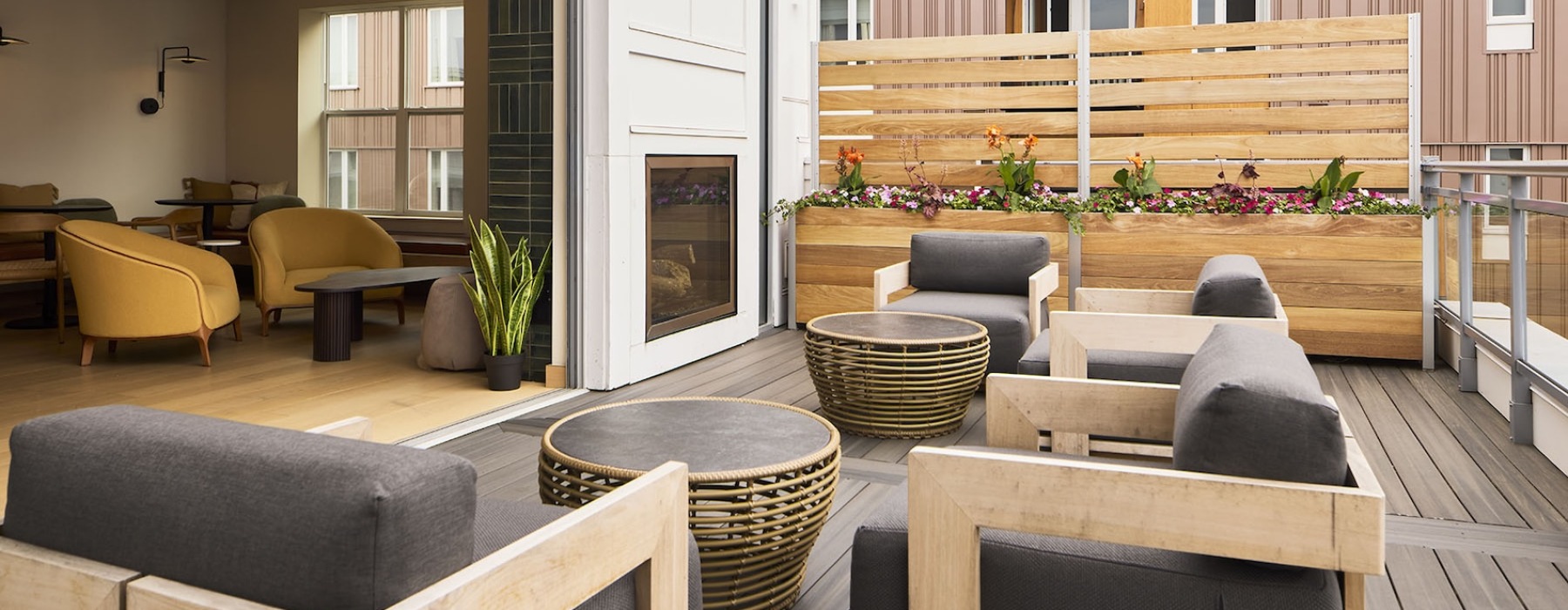 an outdoor witting area with a fire place
